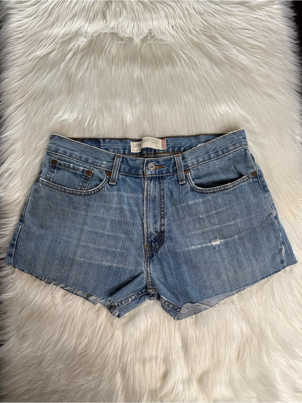 Levi’s Faded Whiskered High Rise Denim Cut Offs from Mens Jeans